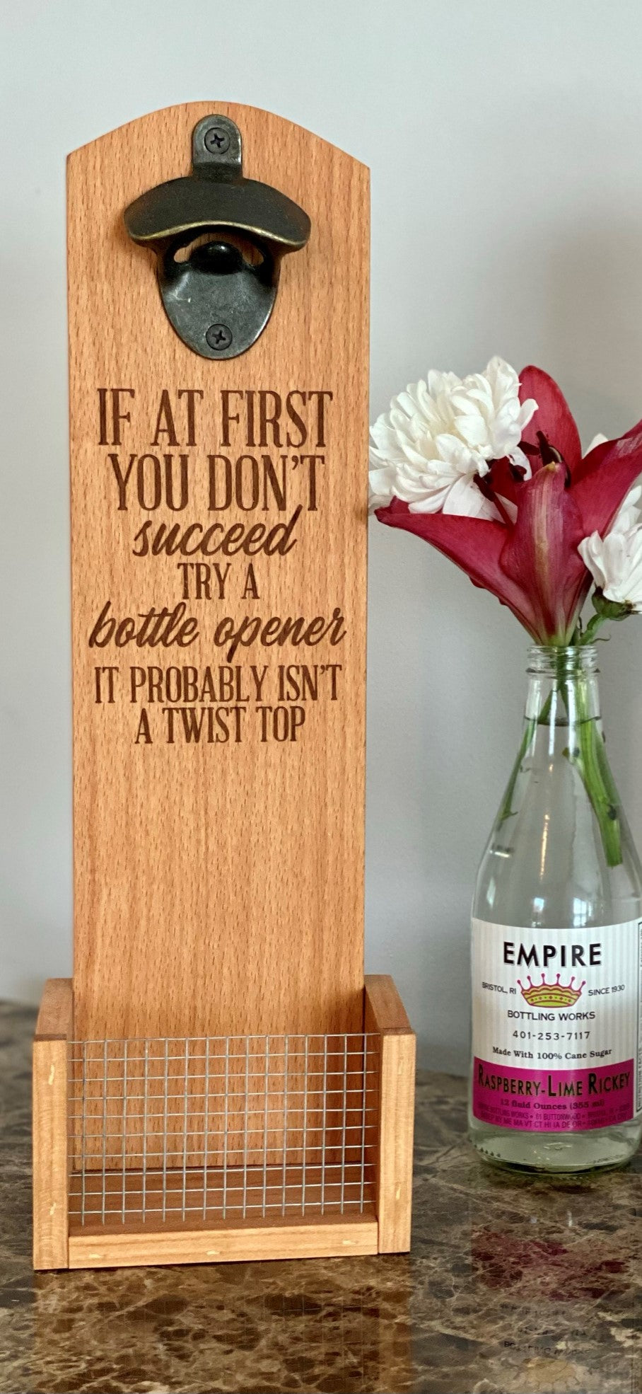 Our wall mount bottle openers are made from the highest quality reclaimed hardwoods. "It's Not A Twist Top" This is available in Beech Wood (Pictured) They make excellent gifts! Check out the cap catcher on the bottom! Product Dimensions: 5" W x 15" H x 4" D