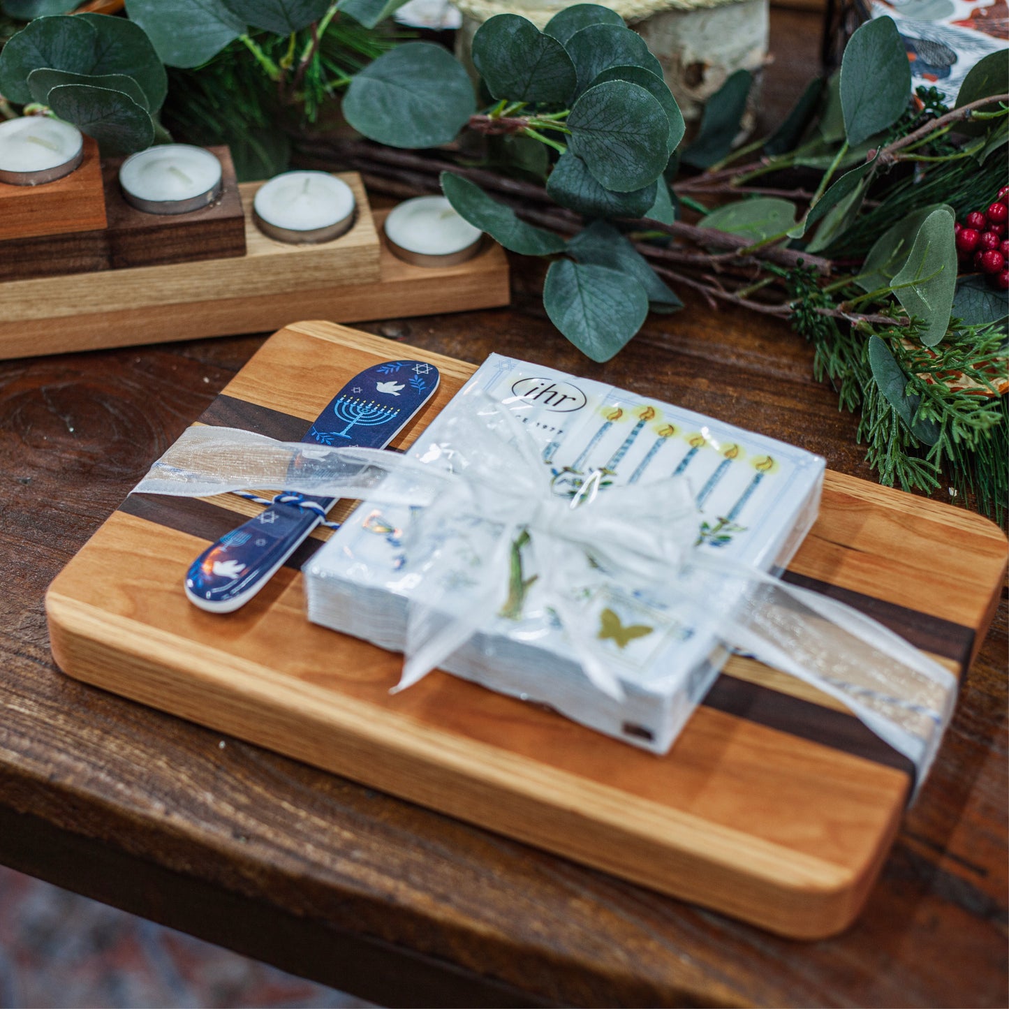 Small rectangle board with Hanukkah cocktail napkins and melamine spreader