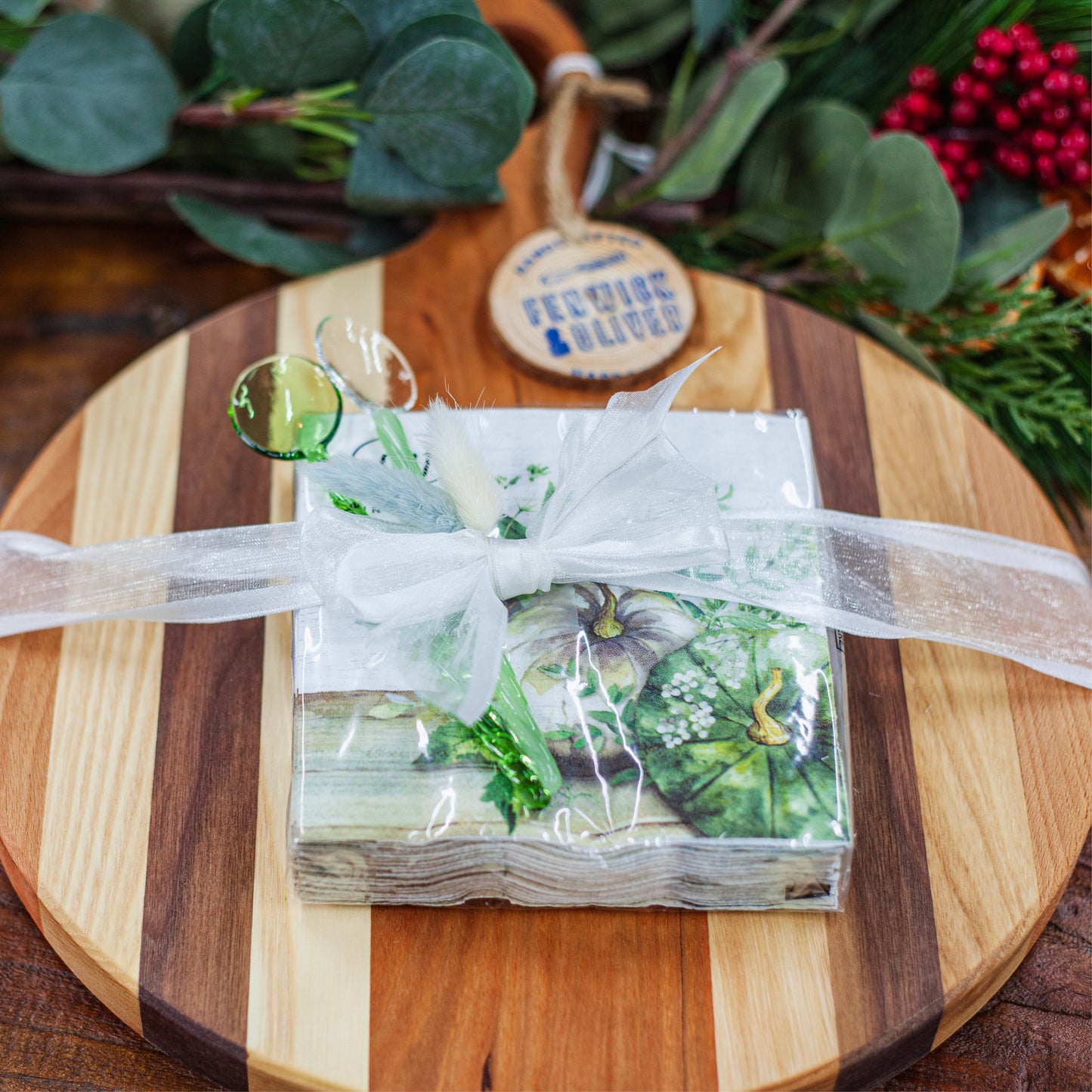 Medium round cheese board (11") with cocktail napkins (seasonal) and 2 glass spoons